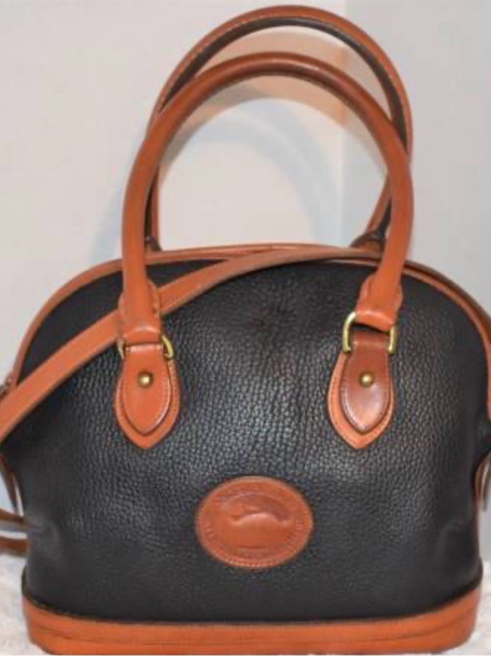 Dooney & Bourke Black and Tan Pebbled Leather Satchel